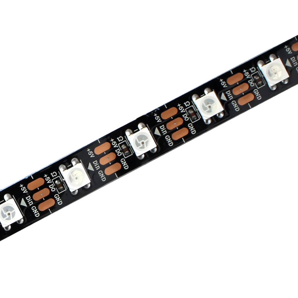 A WS2812B addressable LED strip: white LEDs and copper solder pads on black flexible backing.